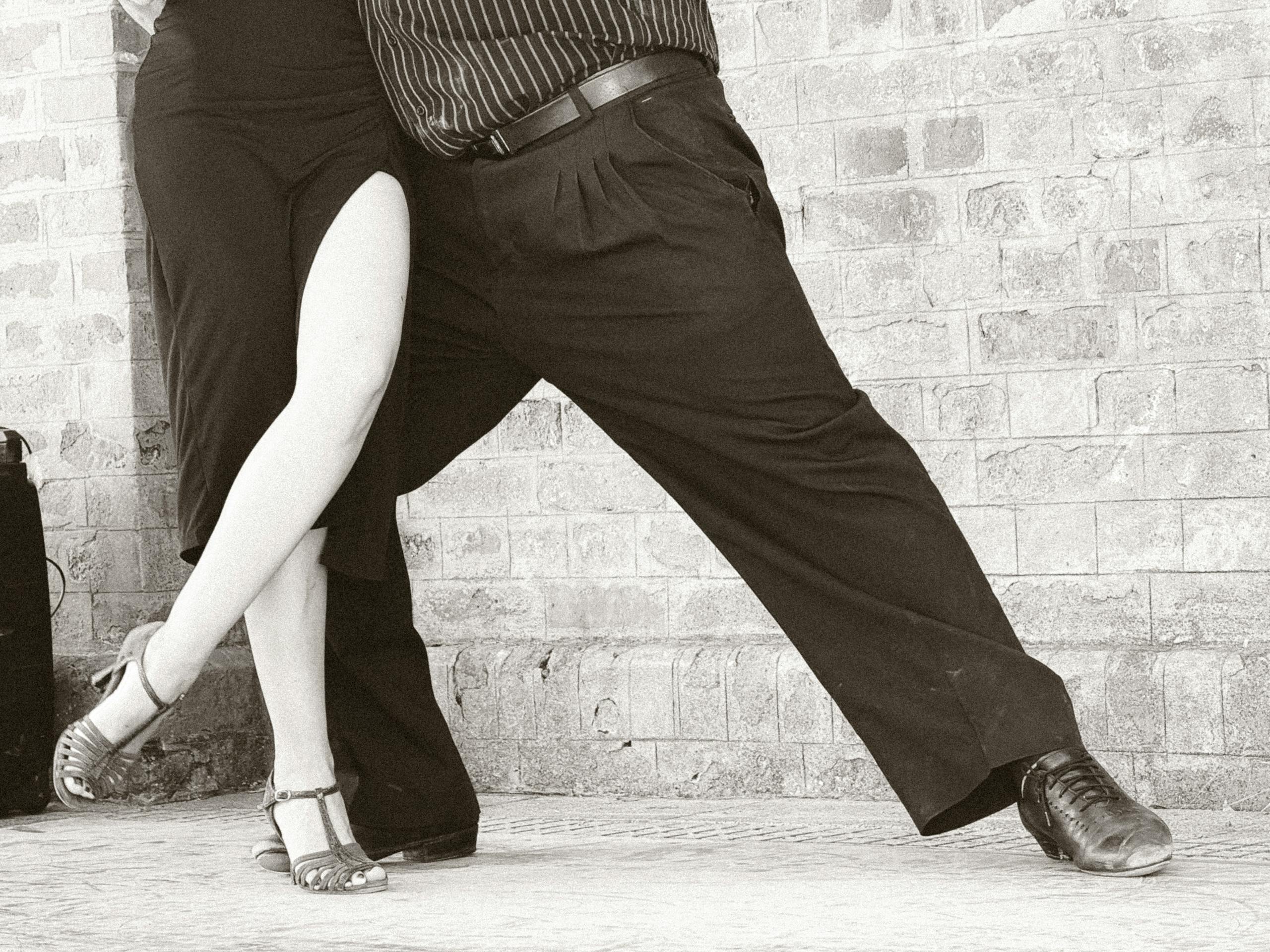 A couple performing an elegant tango dance in Buenos Aires, Argentina.