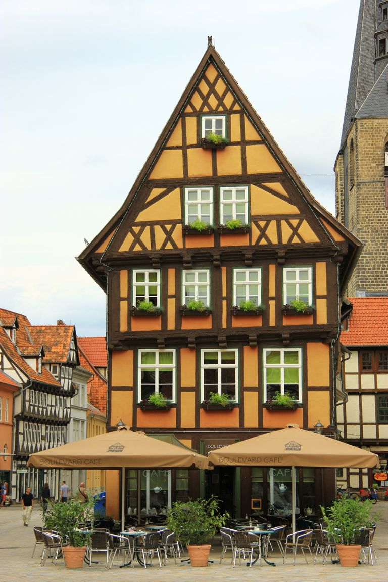 Explore a picturesque half-timbered facade in a quaint European town square.